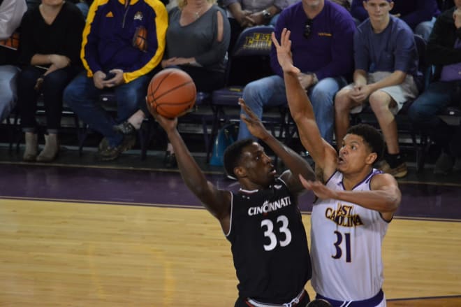 Cincinnati's Nysier Brooks shoots over ECU's Andre Washington in the Bearcats' 55-46 victory.