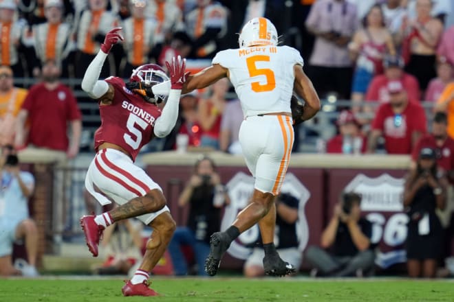 Tennessee Volunteers wide receiver Bru McCoy (5) runs past Oklahoma Sooners defensive back Woodi Washington (5) during a college football game between the University of Oklahoma Sooners (OU) and the Tennessee Volunteers at Gaylord Family - Oklahoma Memorial Stadium in Norman, Okla., Saturday, Sept. 21, 2024.