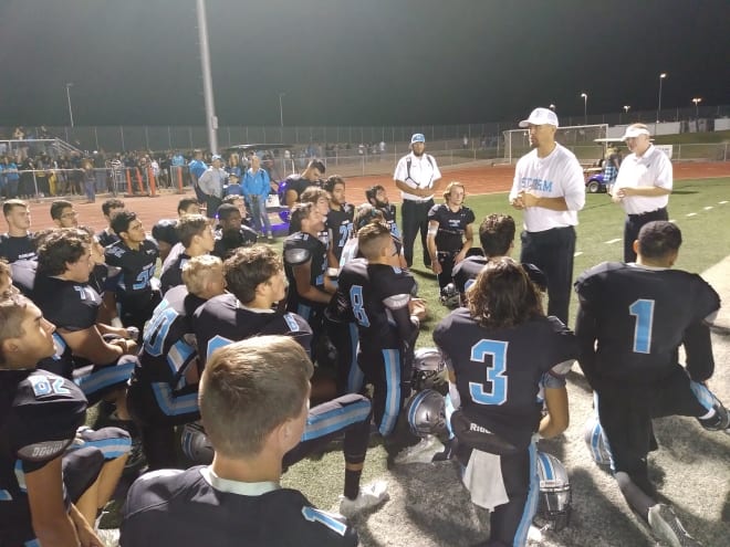 Cleveland head coach Heath Ridenour talks to his team after Friday night's win.