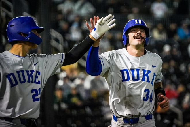 Duke's Ben Miller, right, and AJ Gracia celebrate during Friday night's win at Wake Forest. 