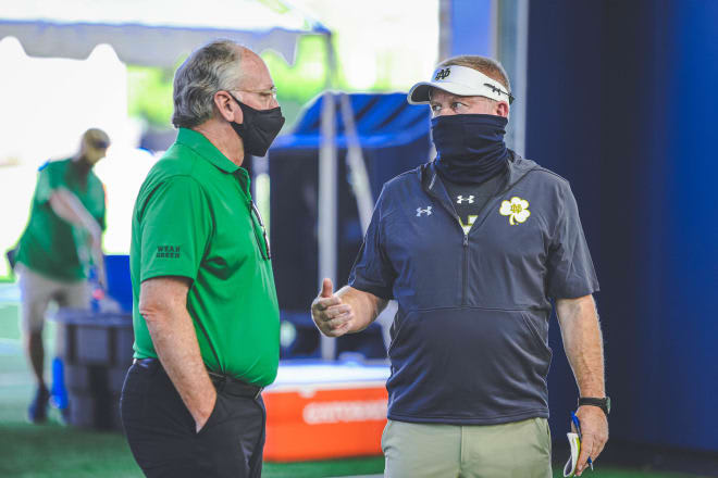 Jack Swarbrick (left)  is proud of the overall teamwork and diligence it took to complete a football regular season amid a pandemic.