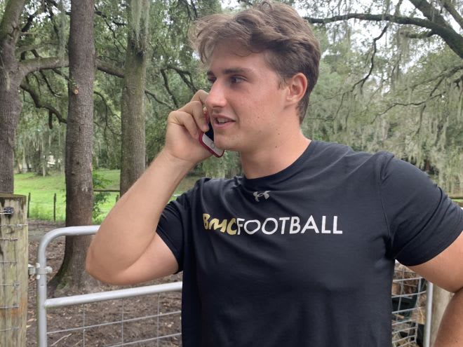DT Charles Rolenc prospect on the phone with Army CB Coach Daryl Dixon as he makes his verbal commitment to the Army Black Knights of West Point