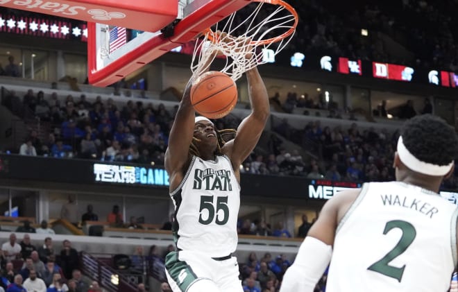 Michigan State's Coen Carr dunks the ball versus Duke on Nov. 14, 2023. 