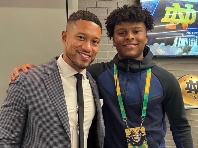 Notre Dame head coach Marcus Freeman (left) and 2023 linebacker commit Jaiden Ausberry (right) pose for a photo during a visit.