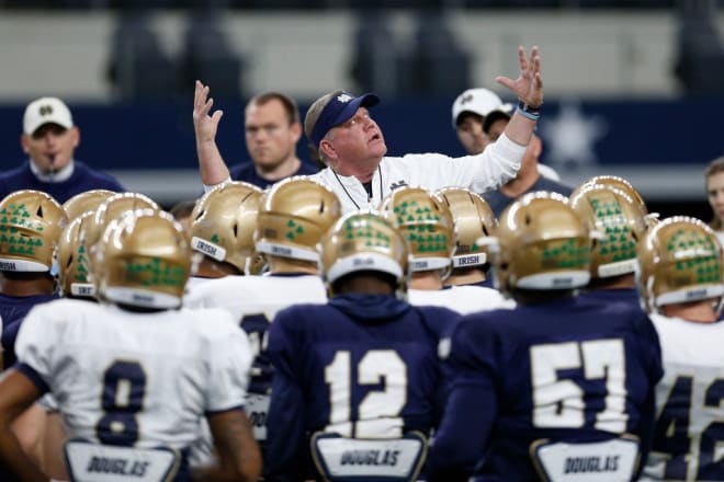 Notre Dame Fighting Irish football head coach Brian Kelly with his players at practice
