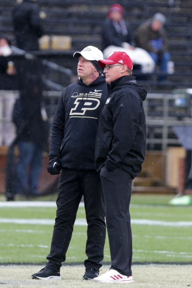 Jeff Brohm and Tom Allen meet at midfield ahead of the 2021 installment of the Old Oaken Bucket game. (Nikos Frazier, Journal and Carrier)