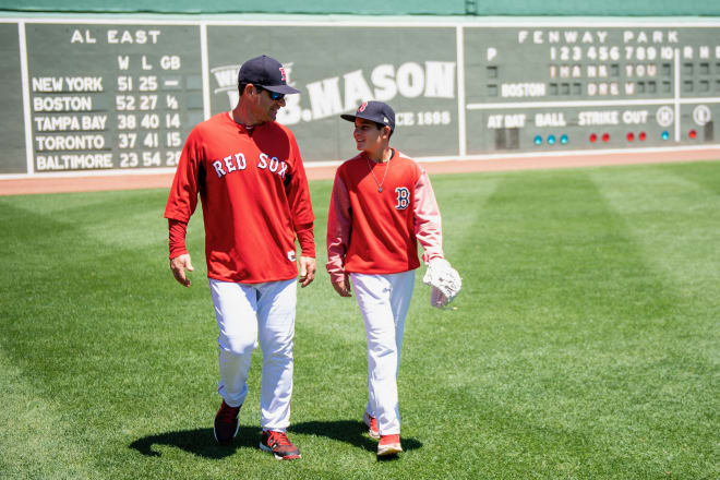 Barkett, here with his son Isaiah, has helped the Boston Red Sox post prolific hitting numbers in 2018.