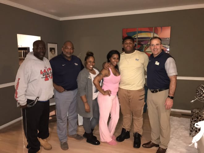 Twyman (second from right) with Pat Narduzzi, Andre Powell, and family