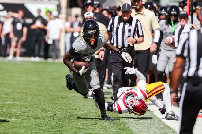 Colorado wide receiver Omarion Miller breaks a tackle and goes 65 yards down the sideline. 