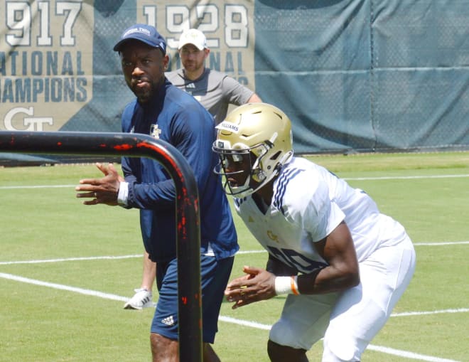 McKenzie works with walk-on RB Englan Williams during a drill at practice this week at Georgia Tech