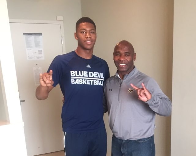 Lloyd poses with coach Strong in the hotel during his official visit
