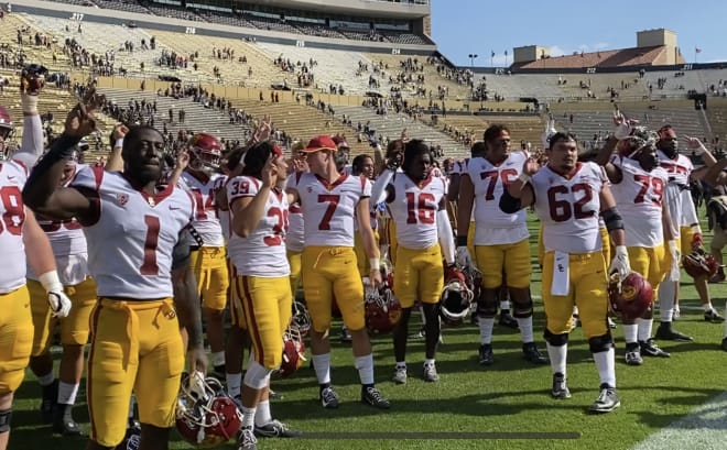 The USC Trojans celebrate after their 37-14 win at Colorado on Saturday.