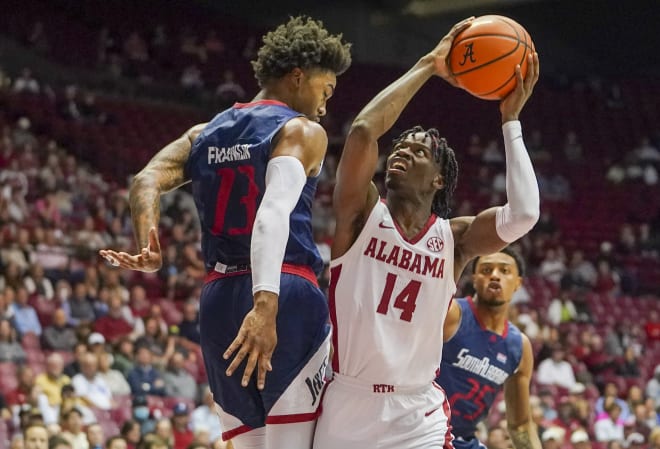 Alabama Crimson Tide guard Keon Ellis (14) goes to the basketball defended South Alabama Jaguars forward Javon Franklin (13)in the first half at Coleman Coliseum. Photo  | USA TODAY