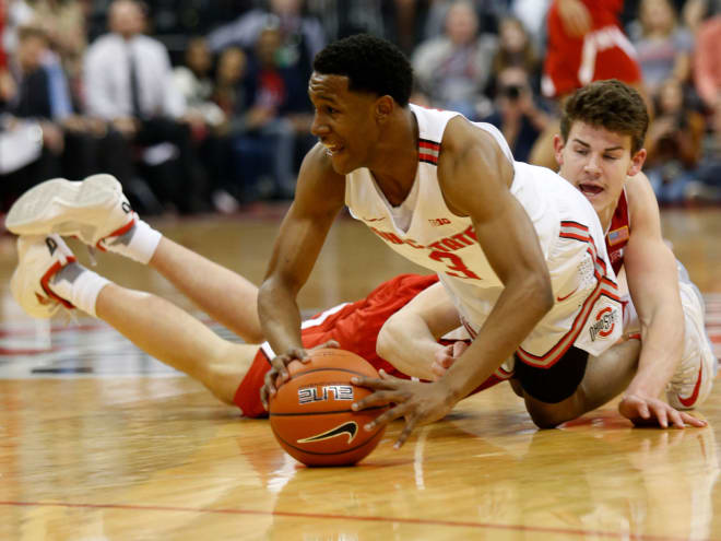Ohio State sophomore guard C.J. Jackson (3) dives for a loose ball while Nebraska's Michael Jacobson falls to the ground.