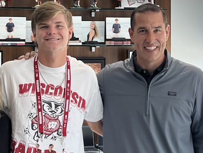 Wisconsin quarterback Landyn Locke and head coach Luke Fickell. 