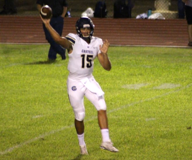 Gunner Cruz prepares to release a pass in Casteel's victory at Apollo in Glendale on Friday.  The senior had six touchdown passes and threw for 445 yards.