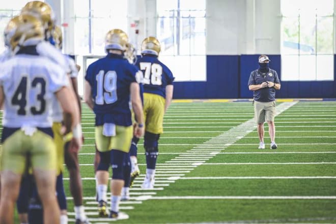 Notre Dame Fighting Irish football head coach Brian Kelly with his team at practice
