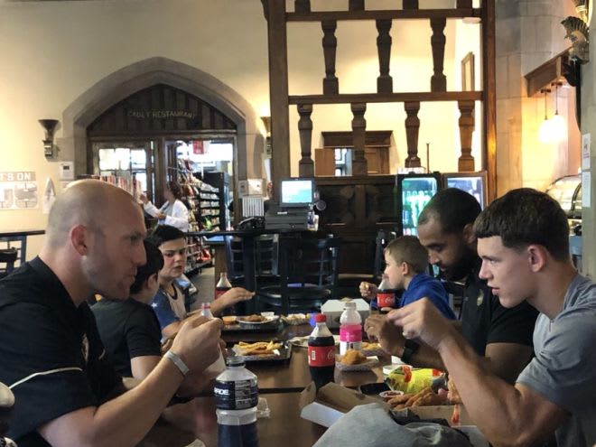 DL Coach Chat Wilt seating with prospect Connor Holmes for morning bite to eat