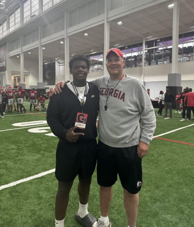 2026 No. 1 center Zykie Helton and Georgia offensive line coach Stacy Searels. Photo via Searels' Twitte.r