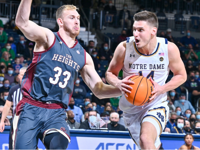Notre Dame forward Nate Laszewski, right, opted to return to the Irish for a fifth season.