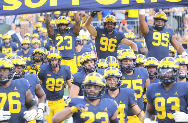 Michiigan Wolverines football head coach Jim Harbaugh is shaking up his staff significantly. 