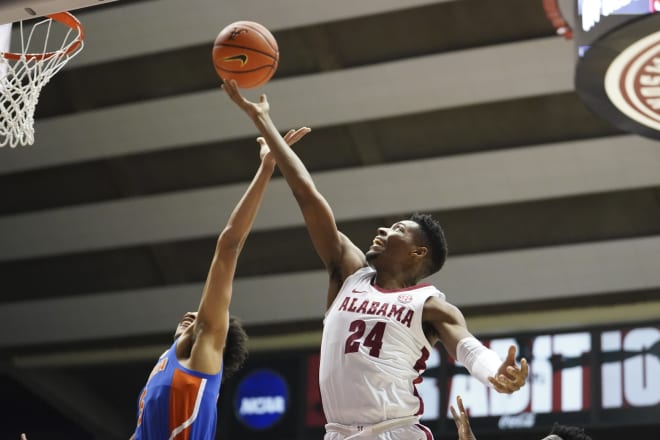 Alabama Crimson Tide forward Brandon Miller (24) grabs a rebound against Florida Gators guard Will Richard (5) during the first half at Coleman Coliseum. Photo |  Marvin Gentry-USA TODAY Sports