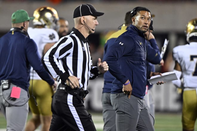 Notre Dame coach Marcus Freeman (right) saw ND's 30-game win streak in regular-season games against ACC teams come to an end on Saturday night.