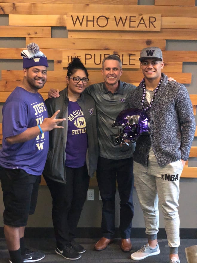 L-R: Pate and Lusi Kaho, the parents of four-star linebacker Ale Kaho (far right), with UW head coach Chris Petersen (center-right), during his official visit  Dec. 15-17. 