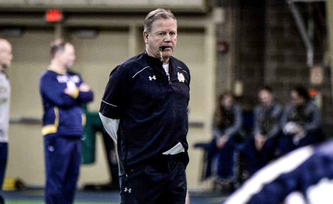 Head coach Brian Kelly watches a drill during practice Wednesday morning.