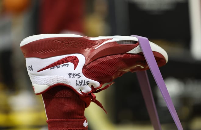 Noah Gurley stretches out before a game. Photo | Robert Sutton / Alabama Athletics