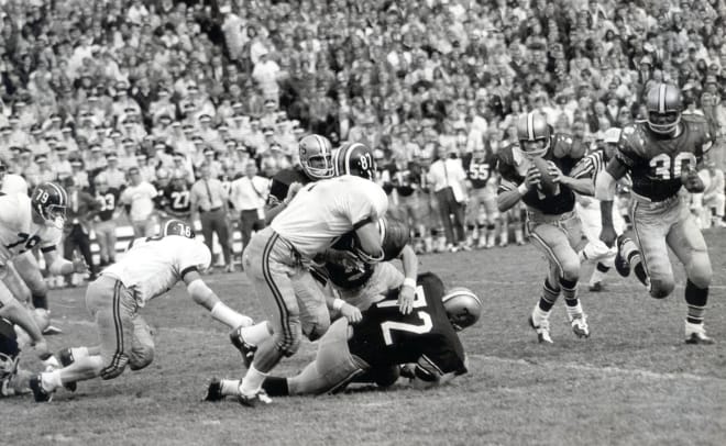 Fullback Wilmer Cooks (30) lead blocks for Bobby Anderson (11) during a 23-9 win over Missouri on Oct. 14, 1967