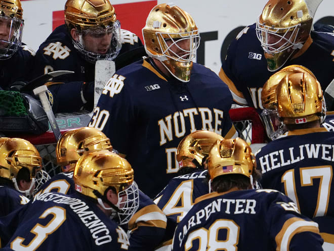 Notre Dame's Ryan Bischel, center, was the Big Ten's Goaltender of the Year for the 2022-23 season.