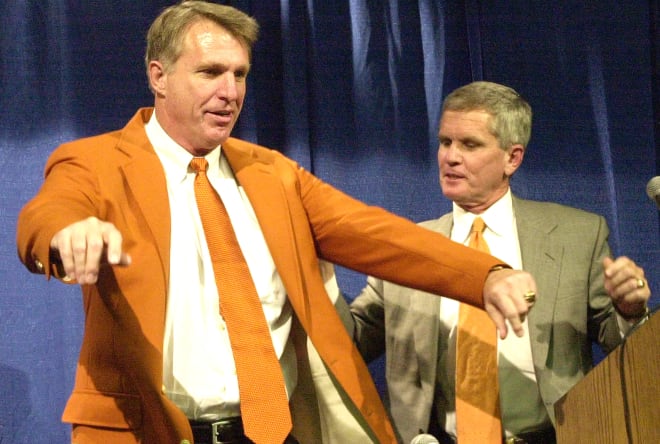 Then Clemson athletics director Terry Don Phillips is shown with then university president James F. Barker in June of 2002.