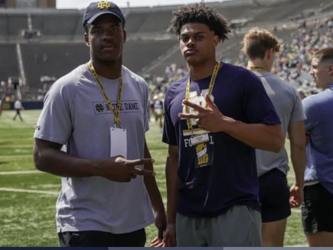 Offensive tackle Aamil Wagner (left) and tight end Holden Staes taking in the Blue-Gold Game as high school seniors on April 23, 2022.