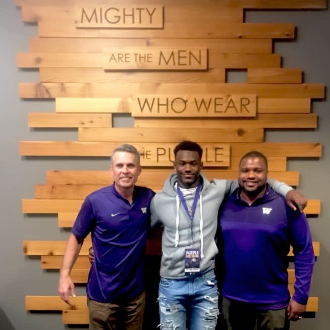 UW head coach Chris Petersen (left) with Jay'Veon Sunday (center) and running backs coach Keith Bhonapha (right) during an unofficial visit in January. 