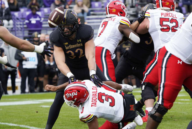 Taulia Tagovailoa (No. 3) fumbles during the first quarter of the Terps' loss at Northwestern. 