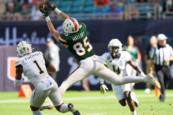 Miami TE Will Mallory hauls in a key third down conversion for the Canes one of six on the day