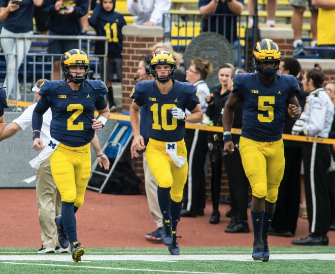 Michigan Wolverines football's Shea Patterson (left), Dylan McCaffrey (middle) and Joe Milton