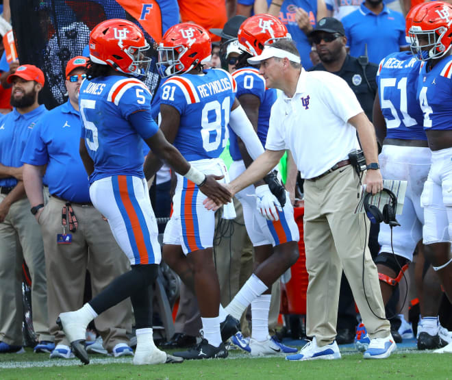 Florida Gators head coach Dan Mullen congratulates Florida Gators quarterback Emory Jones (5) after a touchdown during a football game between the Florida Gators and the Vanderbilt Commodores at Ben Hill Griffin Stadium in Gainesville, Fla. October 9, 2021.