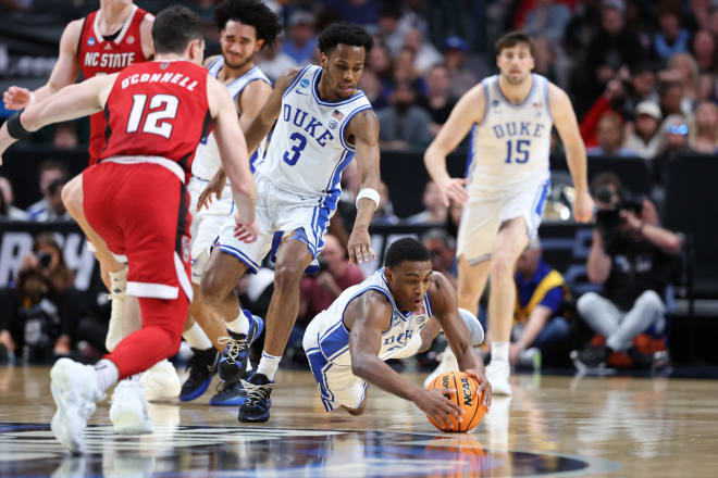 Duke's Jaylen Blakes, right, dives on a loose ball during the NCAA tournament game against N.C. State. 