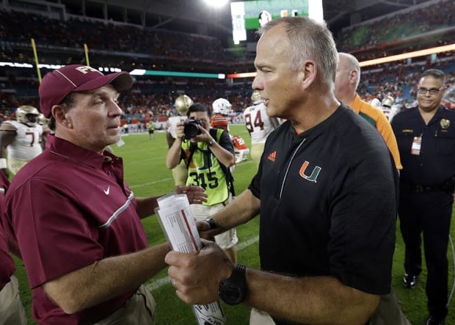 Florida State's Jimbo Fisher and Miami's Mark Richt shake hands from when the two teams played earlier this season.