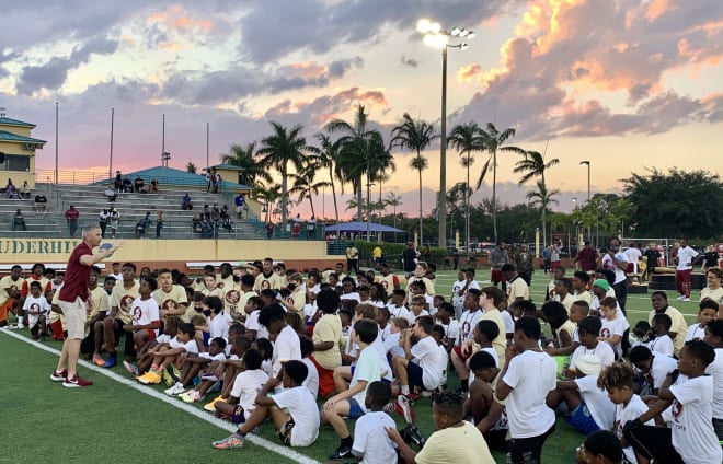 FSU coach Mike Norvell speaks to youths at his football clinic in Broward County last Friday night.