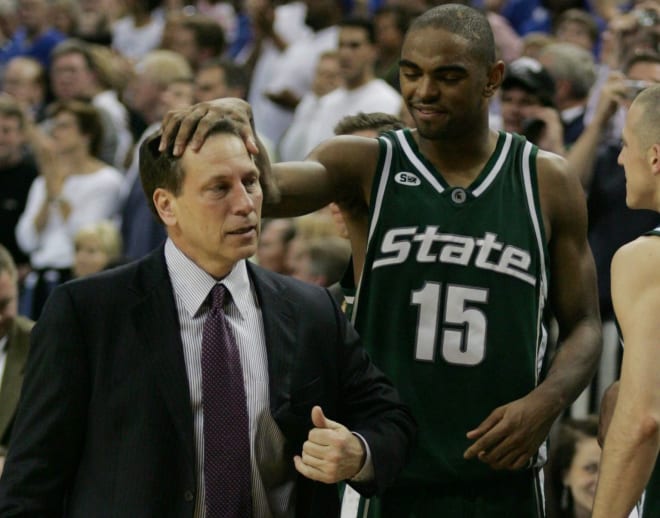 Michigan State's Alan Anderson rubs coach Tom Izzo 's head as the final seconds run off the clock in their double overtime win against Kentucky on Sunday, March 27, 2005, in Austin, Texas, during NCAA Regional Final.