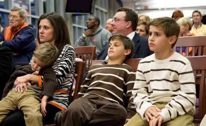 Katheen Swinney and sons look on at Dabo's news conference in 2008.  Immediately behind the family is Dabo's longtime agent, the late Mike Brown.