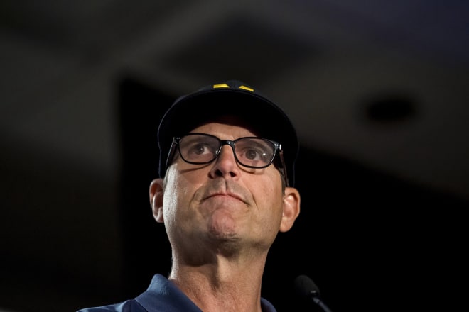 Jim Harbaugh took the questions head on at the Big  Ten football meetings in Chicago.
