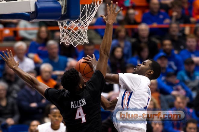 Boise State guard Mikey Thompson (R) goes up for two against SDSU's Dakarai Allen (4).