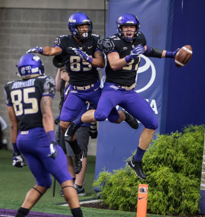 James Madison tight end Clayton Cheatham (37) celebrates his touchdown catch with wide receiver Jake Brown on Saturday during the Dukes' 75-14 win over Norfolk State in Harrisonburg.