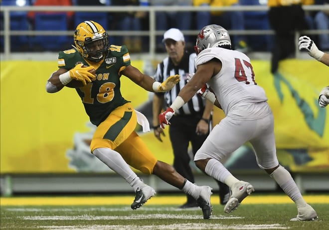 North Dakota State running back Adam Cofield (18) avoids a defender during the Bison's win over Nicholls State in the second round of the FCS playoffs last month at the FargoDome in Fargo, N.D.