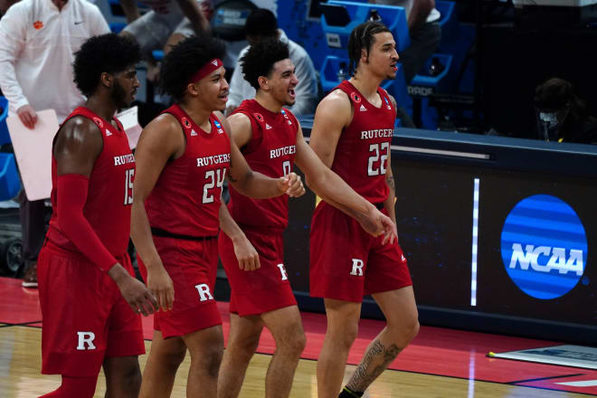 Mar 19, 2021; Indianapolis, Indiana, USA; Rutgers Scarlet Knights guard Geo Baker (0) reacts as he walks with teammates during the second half against the Clemson Tigers in the first round of the 2021 NCAA Tournament at Bankers Life Fieldhouse