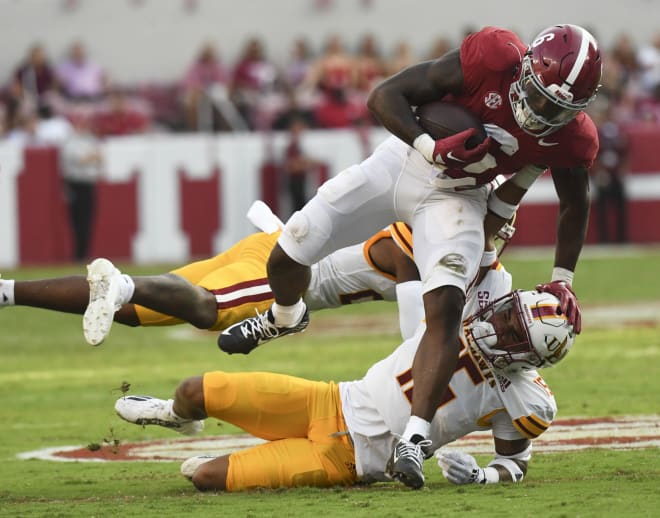 Alabama Crimson Tide running back Trey Sanders (6) is tackled by UL Monroe Warhawks defensive back Simion Hines (15) at Bryant-Denny Stadium. Sanders was called for an offensive face mask penalty. Photo | Gary Cosby Jr.-USA TODAY Sports